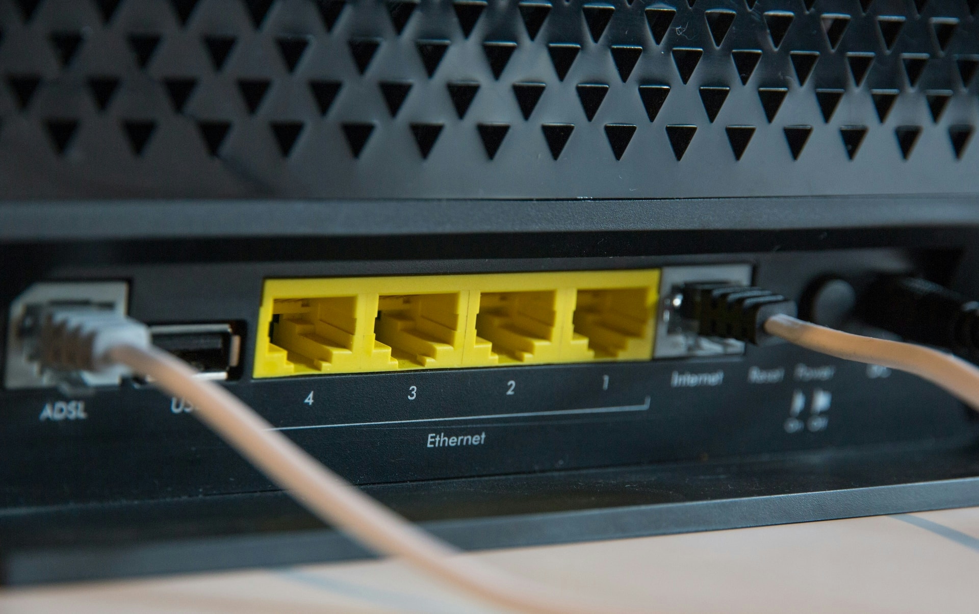 An image of a router with plugged in cables
